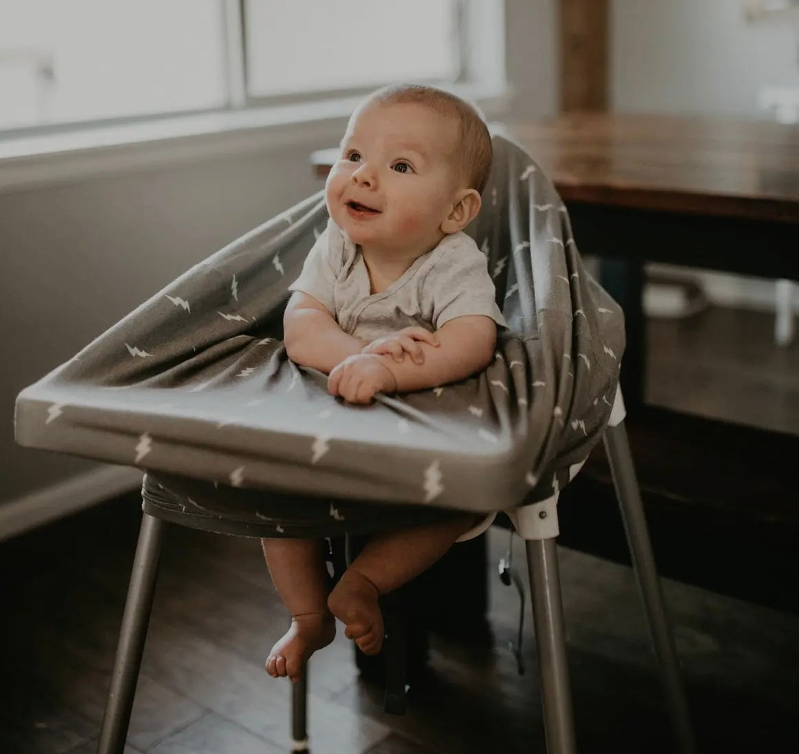 4 in 1 a car seat cover, nursing cover, grocery cart cover, and high chair cover.