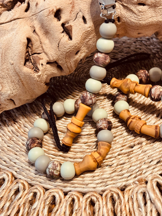 Duck call pacifier clip